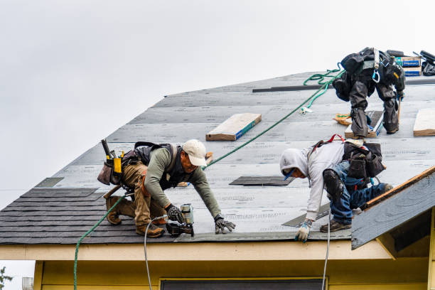 Professional Roofing technician working in Harrah, WA